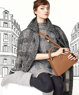 Woman in gray coat holding brown leather handbag against illustrated building backdrop