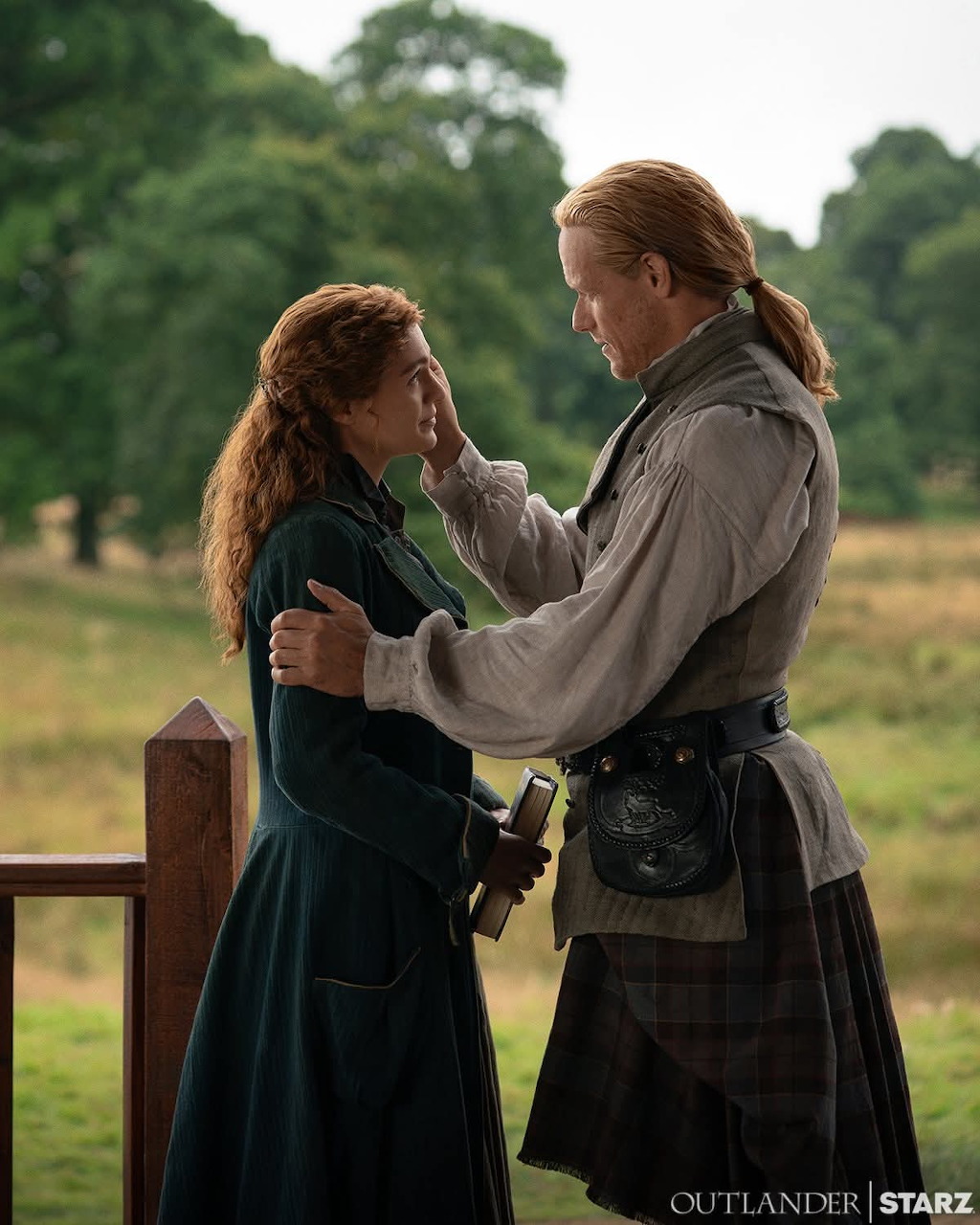 Outlander-inspired artwork with two main characters in Highland period clothing.