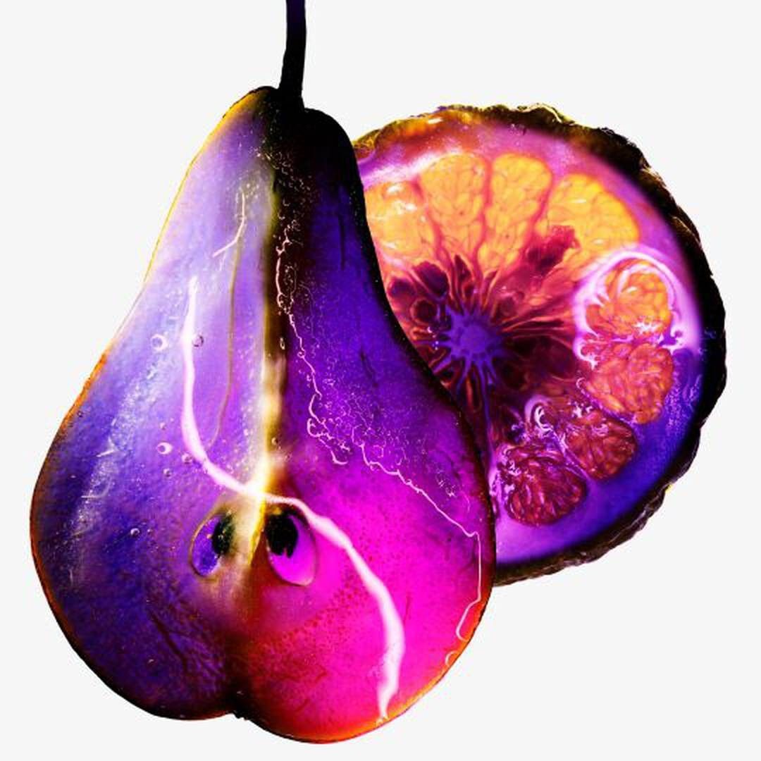 Cross-section of purple eggplant showing interior flesh and seeds with vibrant gradient colors