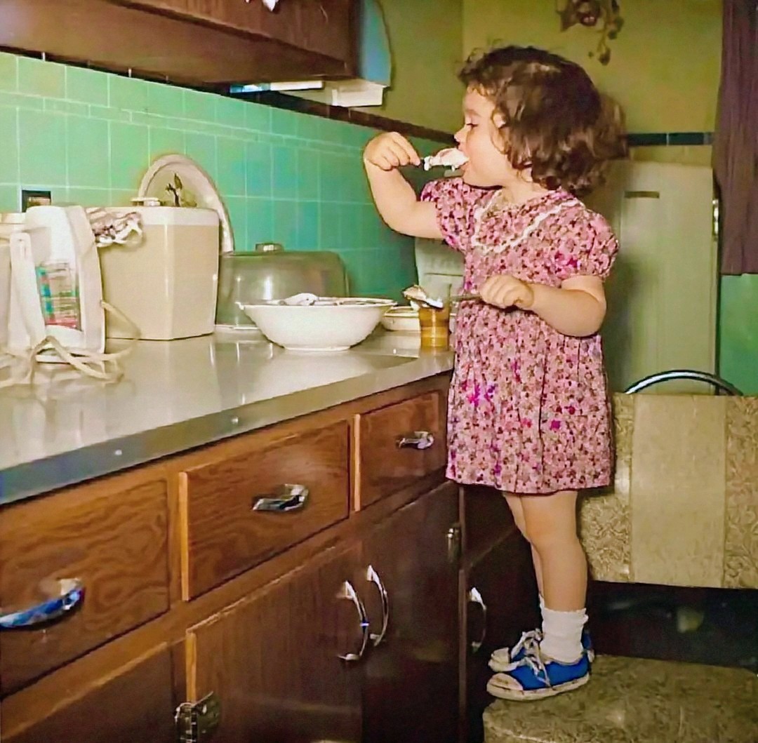 Little Girl Eating Frosting