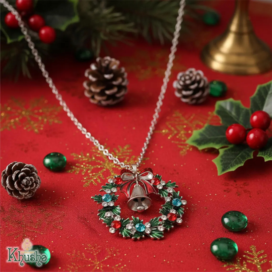 Christmas necklace with wreath and bell pendant on a red holiday background with pinecones and holly