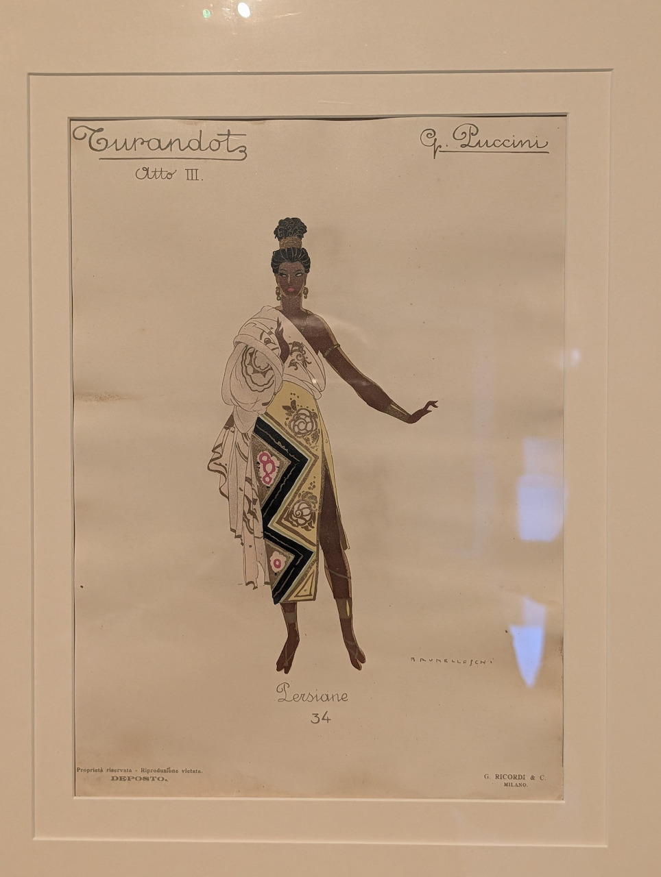 Framed vintage costume design sketch of a figure in a long dress with geometric details