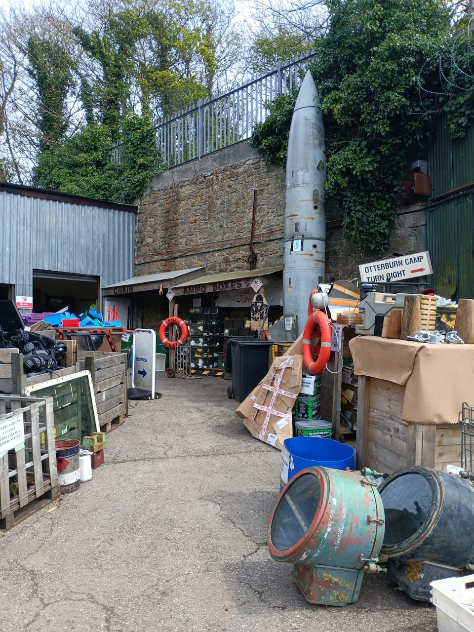 Outdoor scrap yard filled with junked vehicles and metal debris