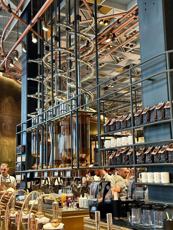 Starbucks Reserve Roastery Milano interior with tall copper pipes, coffee shelves, and baristas at work