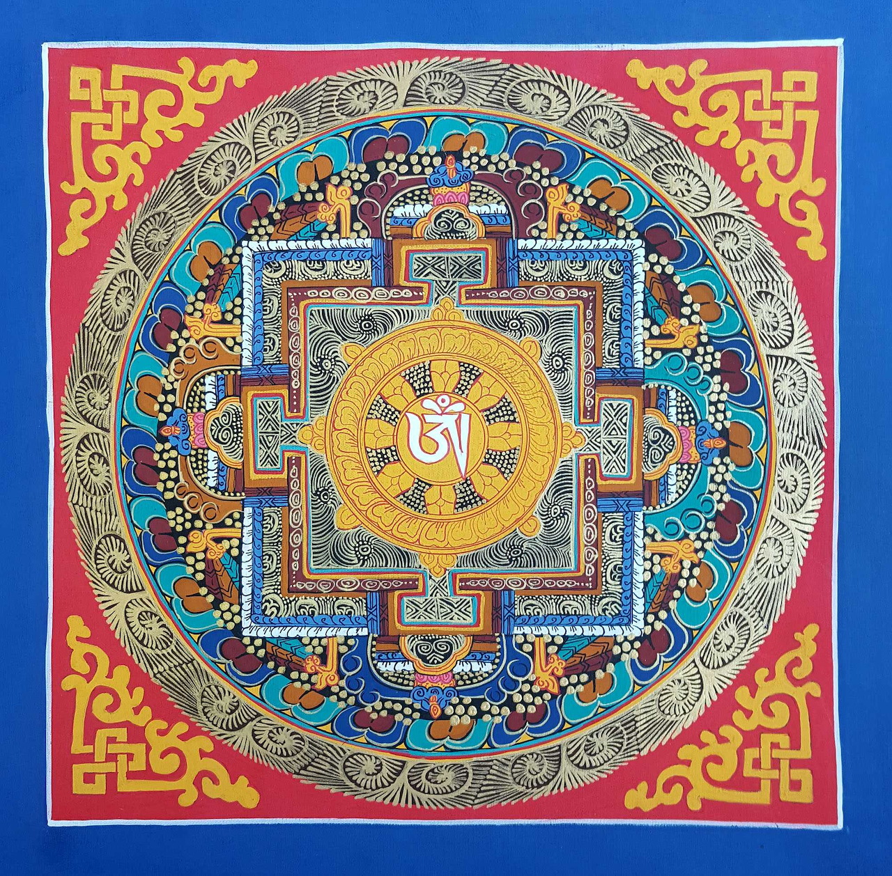 Colorful Tibetan Buddhist mandala with intricate geometric patterns and sacred symbols in blue, gold, and red