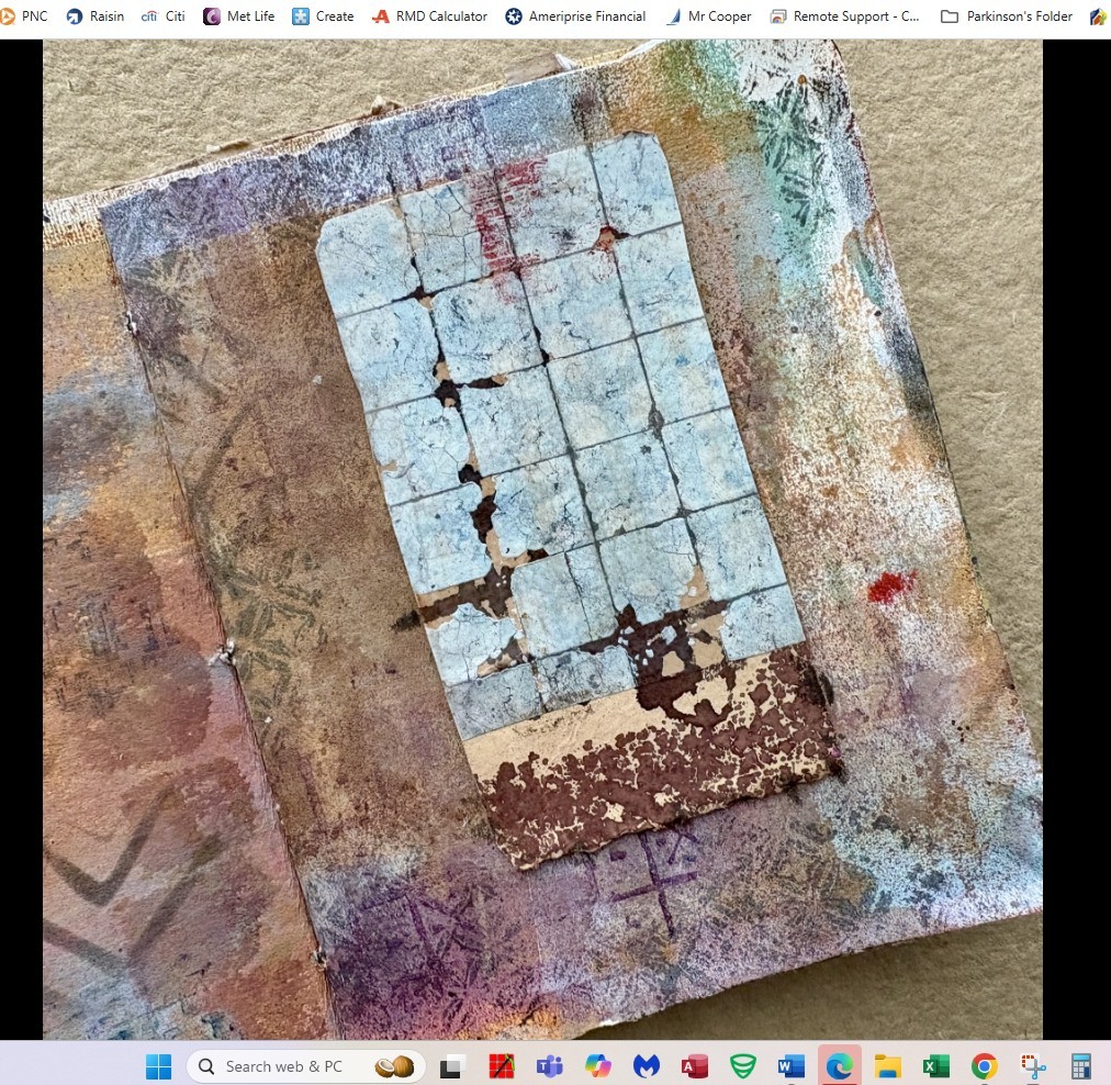 Close-up of an abstract mixed-media collage with a gridded, peeling paper piece on a textured background.