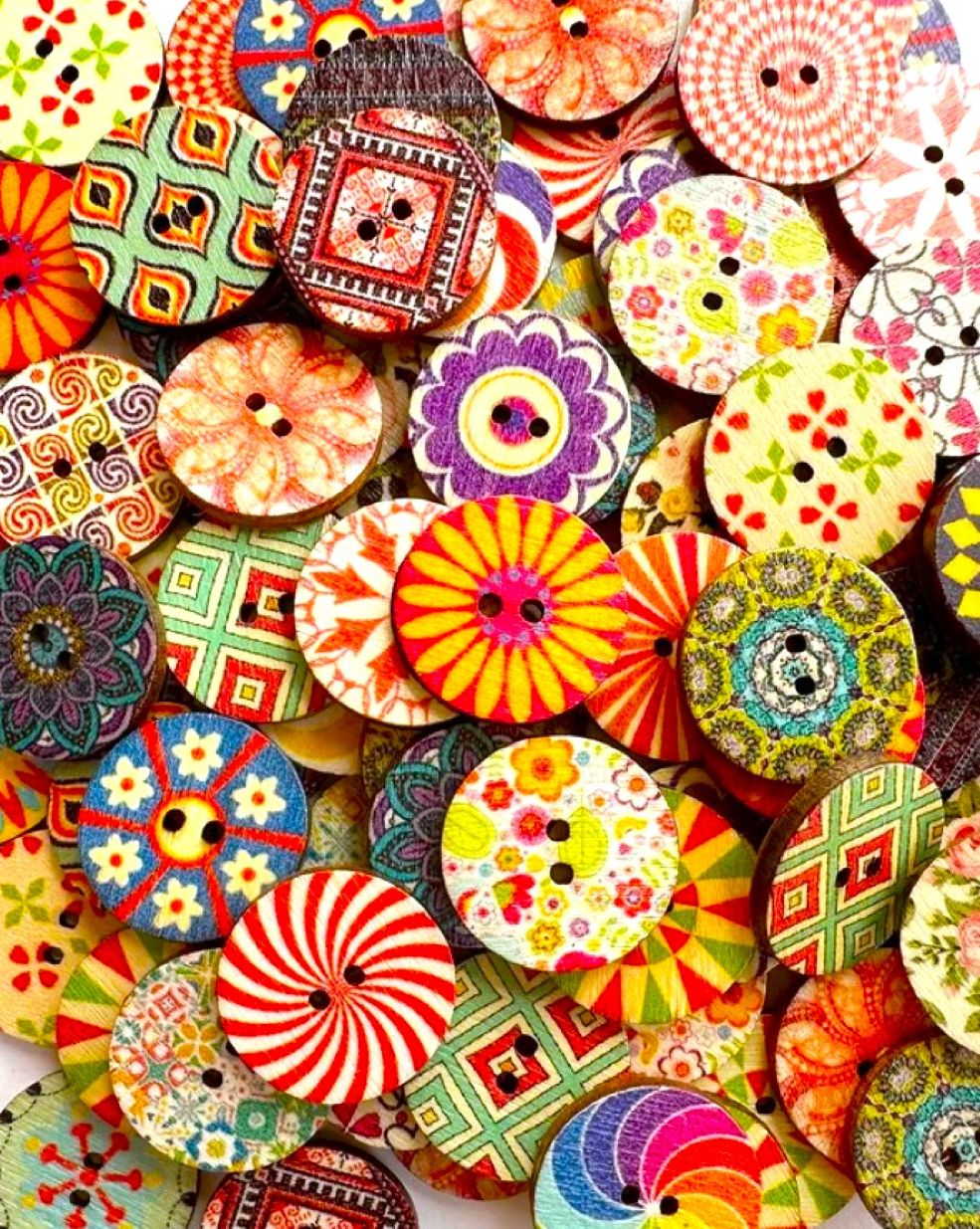 Assortment of colorful painted wooden buttons with various decorative patterns and designs