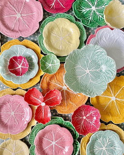 Colorful handmade flower decorations in various colors arranged together