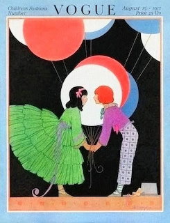1917 Vogue magazine cover with Art Deco illustration of two costumed figures under geometric circles and red sun