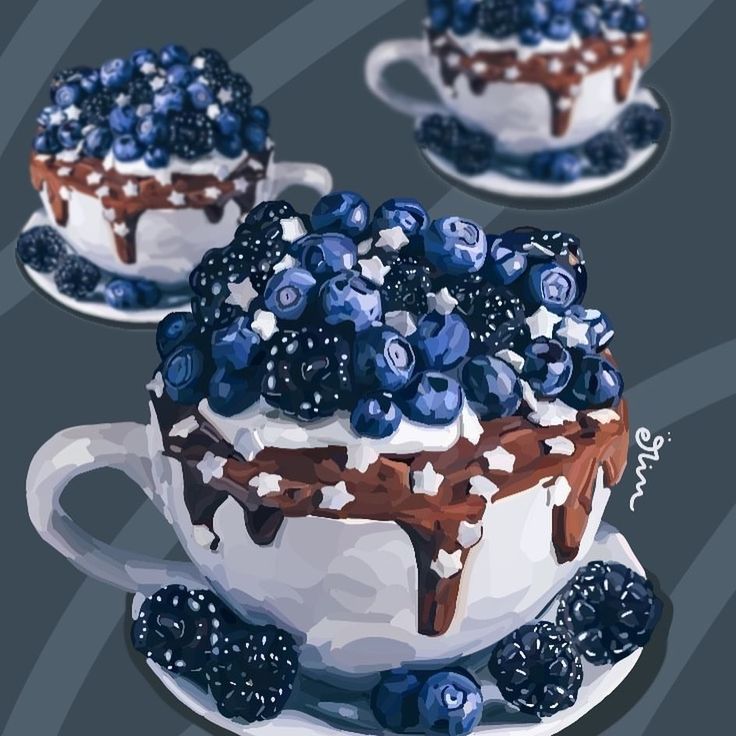 White teacups with chocolate dessert topped with blueberries and blackberries on saucers