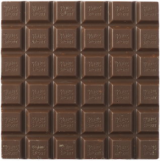 Grid of chocolate bar squares with embossed text on dark brown surface