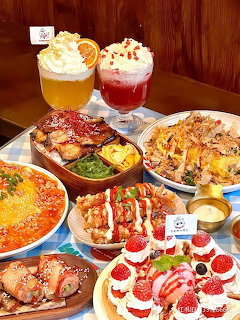 Variety of colorful food dishes and drinks with whipped cream on a wooden table