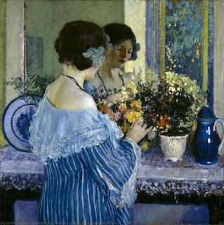 Woman in blue dress arranging flowers by window in impressionist style painting