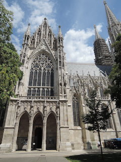 Neo-Gothic Votivkirche church with twin spires and ornate stone facade in Vienna