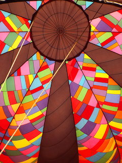 Interior view of hot air balloon with colorful geometric triangular fabric panels radiating from center