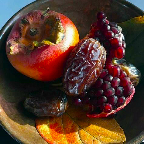 Colorful assortment of fresh fruits including apples, oranges, grapes and berries