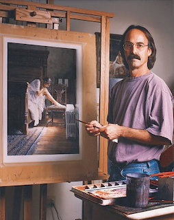 Man with mustache and glasses standing at an easel with a paintbrush next to his realistic watercolor painting