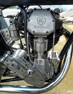 Vintage Excelsior Manxman motorcycle engine with chrome parts and embossed casing