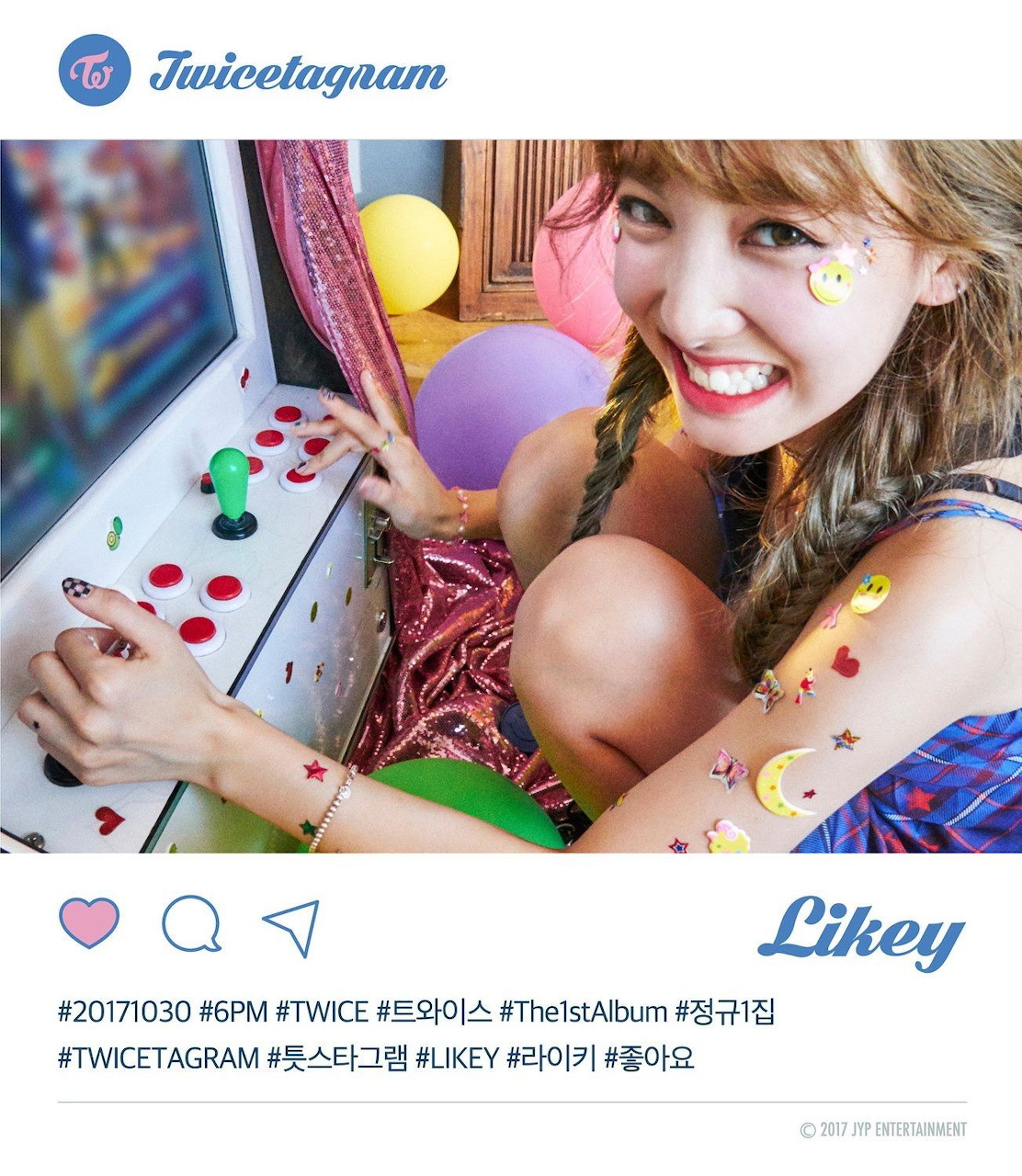 TWICE Nayeon smiling at an arcade machine with colorful balloons and face stickers in Likey concept photo