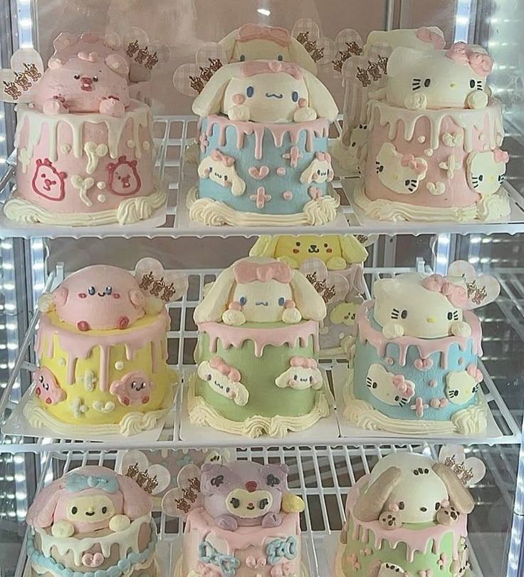 Nine pastel Sanrio character cakes with Hello Kitty and Cinnamoroll decorations on bakery display shelves