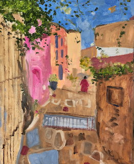 Colorful expressionist painting of a Mediterranean village street with pink and terracotta buildings under blue sky