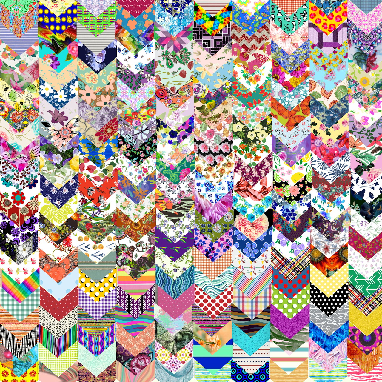 Dense colorful patchwork quilt with chevron zigzag patterns in various fabrics and prints