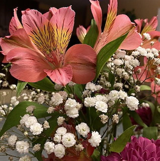 Bouquet with pink alstroemeria, white baby's breath, and red mums