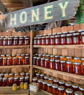 Honey Jars on Wooden Shelves