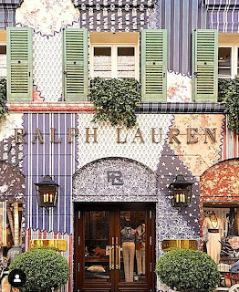 Ralph Lauren store with decorative patterned facade, green shutters, floral accents, and ornate architectural details