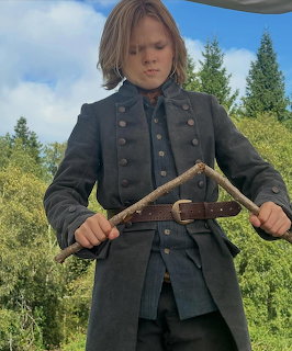 Boy in Period Costume Outdoors