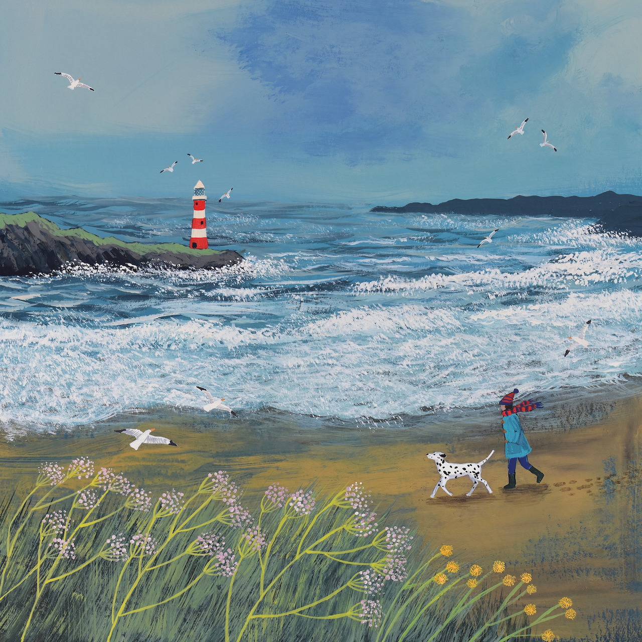 Person walking white dog on beach with lighthouse, waves, and coastal plants under blue sky
