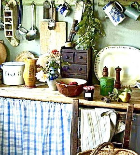 Cozy kitchen interior with wooden cabinets and cookware in warm light