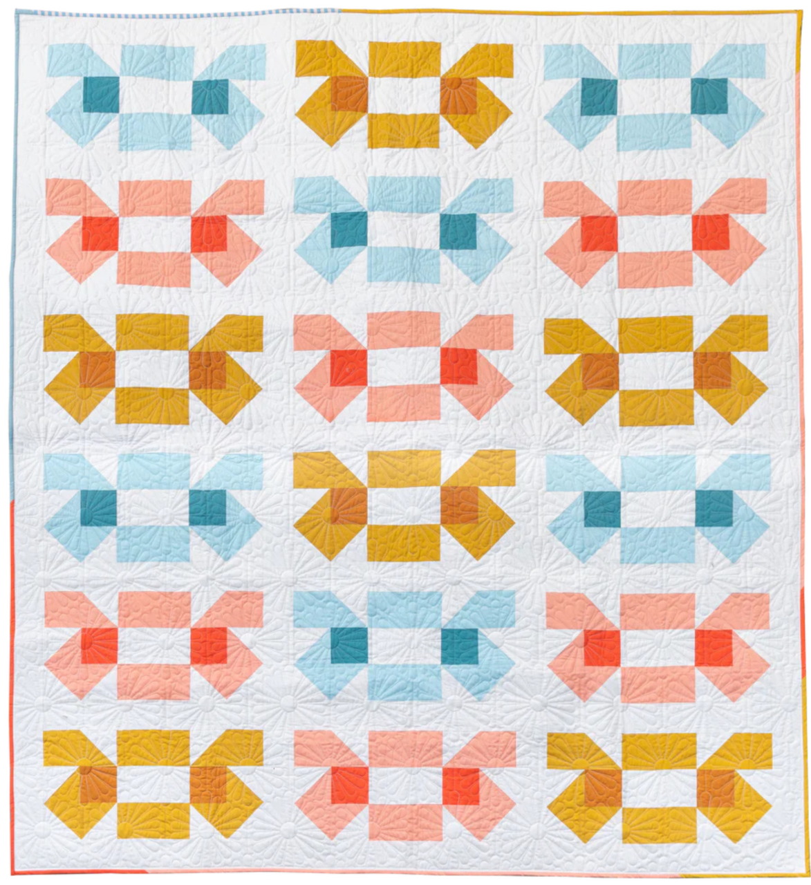 Modern quilt with geometric bow-tie pattern in coral, teal, mustard and pink blocks on white background