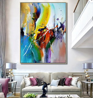 Modern living room with beige sofa and vibrant abstract painting on wall