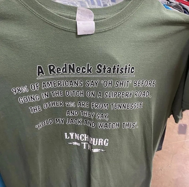 Olive green t-shirt with white printed text reading redneck statistic joke