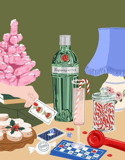 Illustration of a tabletop with a bottle, candy jar, cards, pastries, pink flowers, and a blue lamp