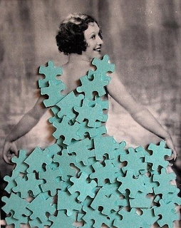 Vintage photo of woman in dress constructed from turquoise jigsaw puzzle pieces