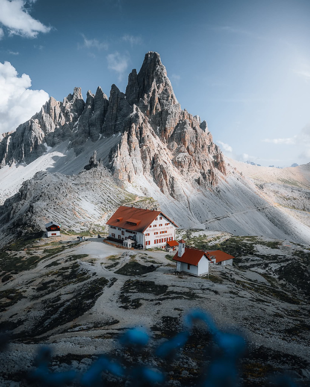 Dolomites alpine peaks rising above green meadows under a clear sky