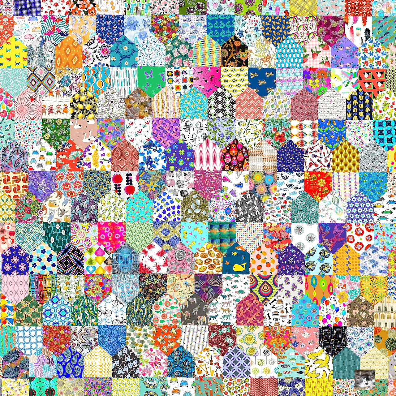 Colorful patchwork quilt with small squares showing various patterns and fabrics in bright colors