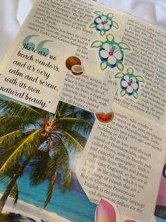Journal page with tropical beach photo, sea turtle stickers, flower drawings, and handwritten beach quote over newspaper