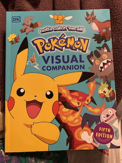 Pokémon Visual Companion book cover with Pikachu prominently displayed alongside other Pokémon characters